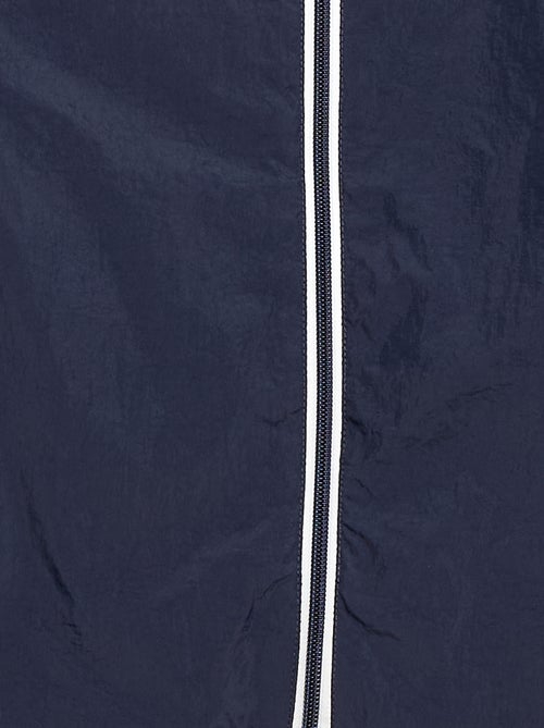 Cortavientos liso que se guarda en su capucha - Kiabi