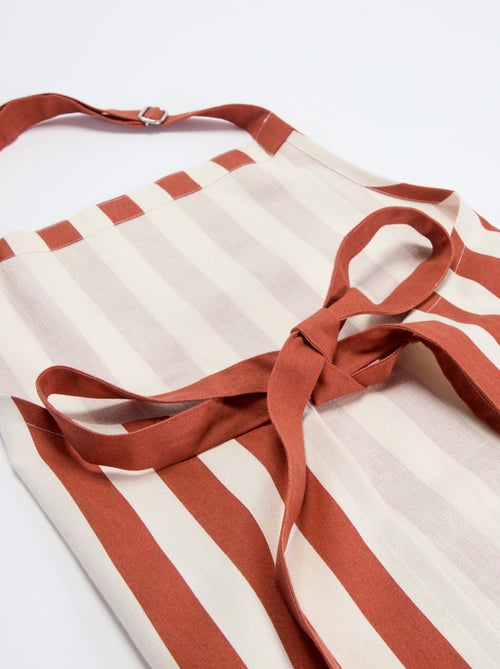 Delantal a rayas con bolsillo bordado - Kiabi Delantal a rayas con bolsillo bordado - Kiabi