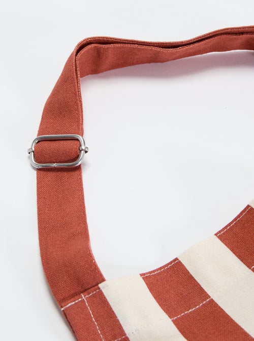 Delantal a rayas con bolsillo bordado - Kiabi Delantal a rayas con bolsillo bordado - Kiabi