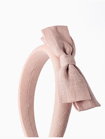 Diadema acolchada con lazo en la parte superior