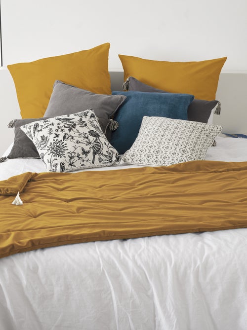 Edredón de terciopelo con borlas - Kiabi