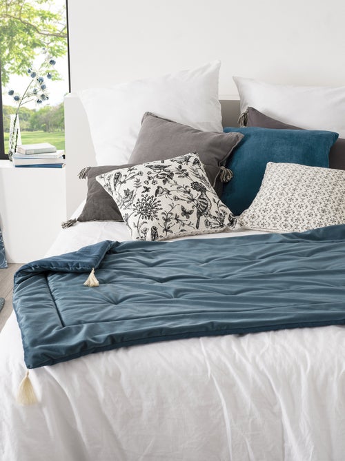 Edredón de terciopelo con borlas - Kiabi