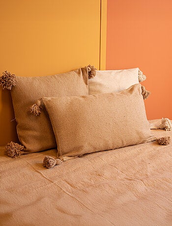 Funda de cojín de lana con borlas