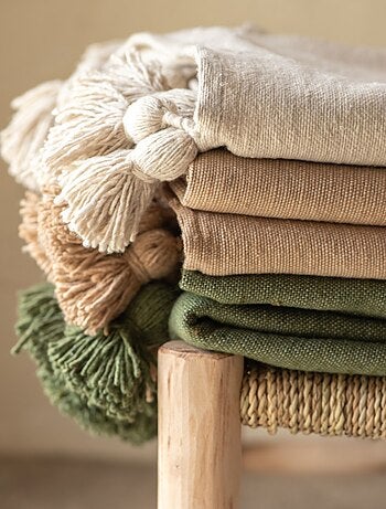 Funda de sofá grande de lana con borlas