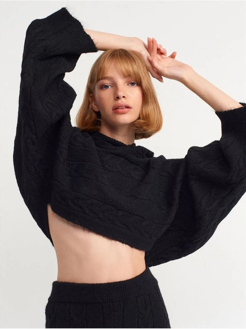 Jersey corto oversize de punto trenzado con capucha - Kiabi Jersey corto oversize de punto trenzado con capucha - Kiabi