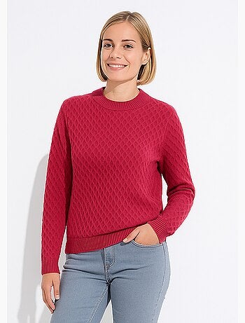 Jersey corto y cálido con cuello alto de punto grueso.