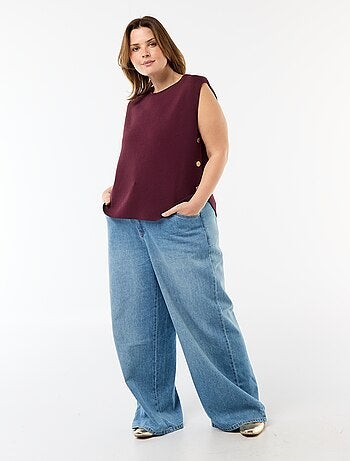 Jersey sin mangas con botones dorados en el lateral