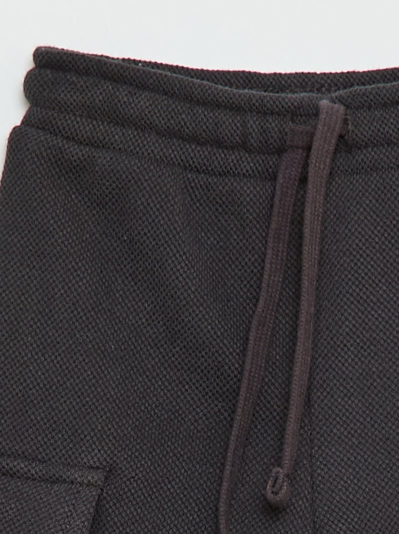Jogging multibolsillos liso Negro - Kiabi