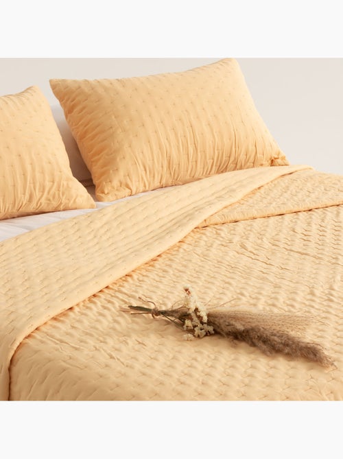 Juego de colcha lisa tejido acolchado, con funda de cojín. - Kiabi