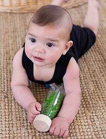 Juguete botella sensorial para bebé con sonido | Petit Boum
