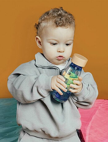 Juguete botella sensorial para bebé con sonido | Petit Boum