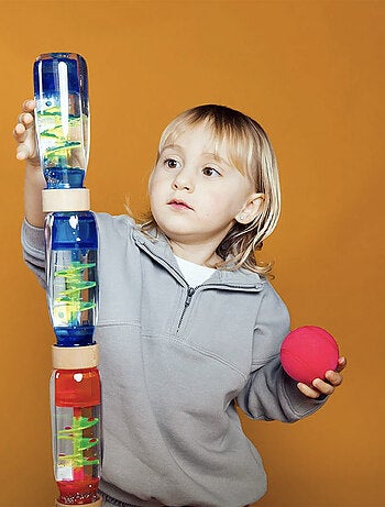 Juguete botella sensorial para bebé con sonido | Petit Boum