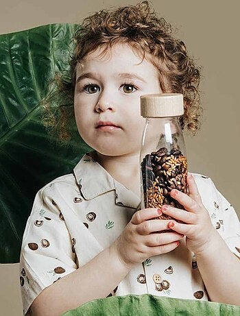 Juguete botella sensorial para bebé con sonido | Petit Boum