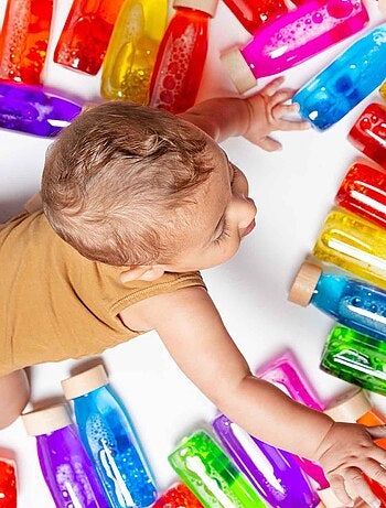 Juguete botella sensorial para bebé con sonido | Petit Boum