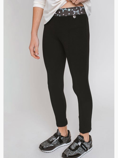 Leggings de niña con cintura de estrellas en negro - Kiabi Leggings de niña con cintura de estrellas en negro - Kiabi