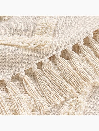 Manta tufted con borlas