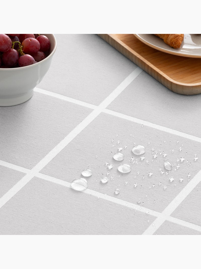 Mantel antimanchas con tejido texturizado, diseño a cuadros grandes -  Gamusi. Gris claro - Kiabi