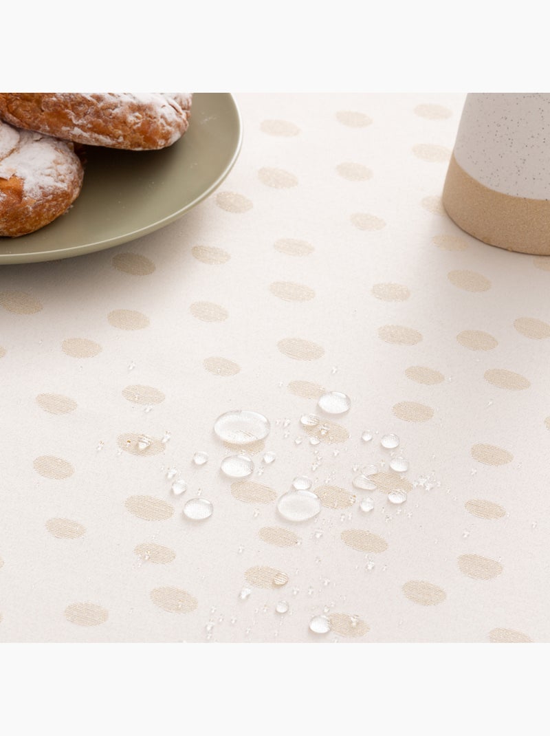 Mantel antimanchas con tejido texturizado, diseño a puntos -  Gamusi. Oro - Kiabi