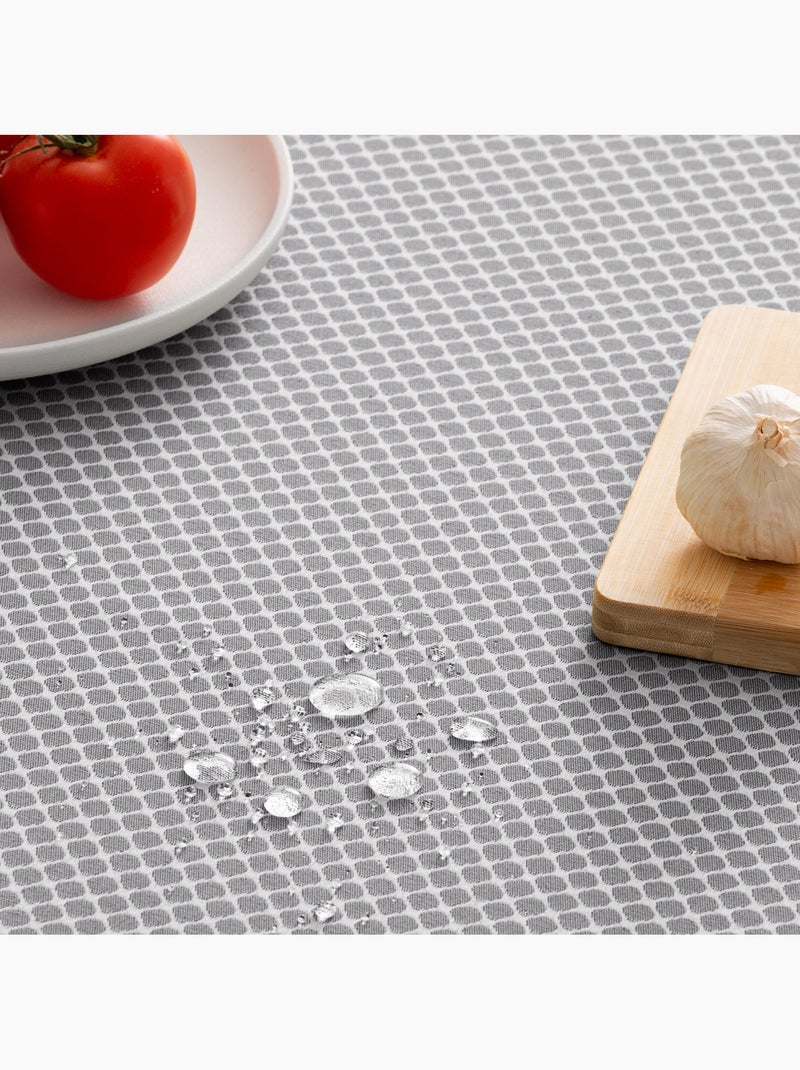 Mantel antimanchas con tejido texturizado, diseño cuadros en rejilla -  Gamusi. Gris antracita - Kiabi