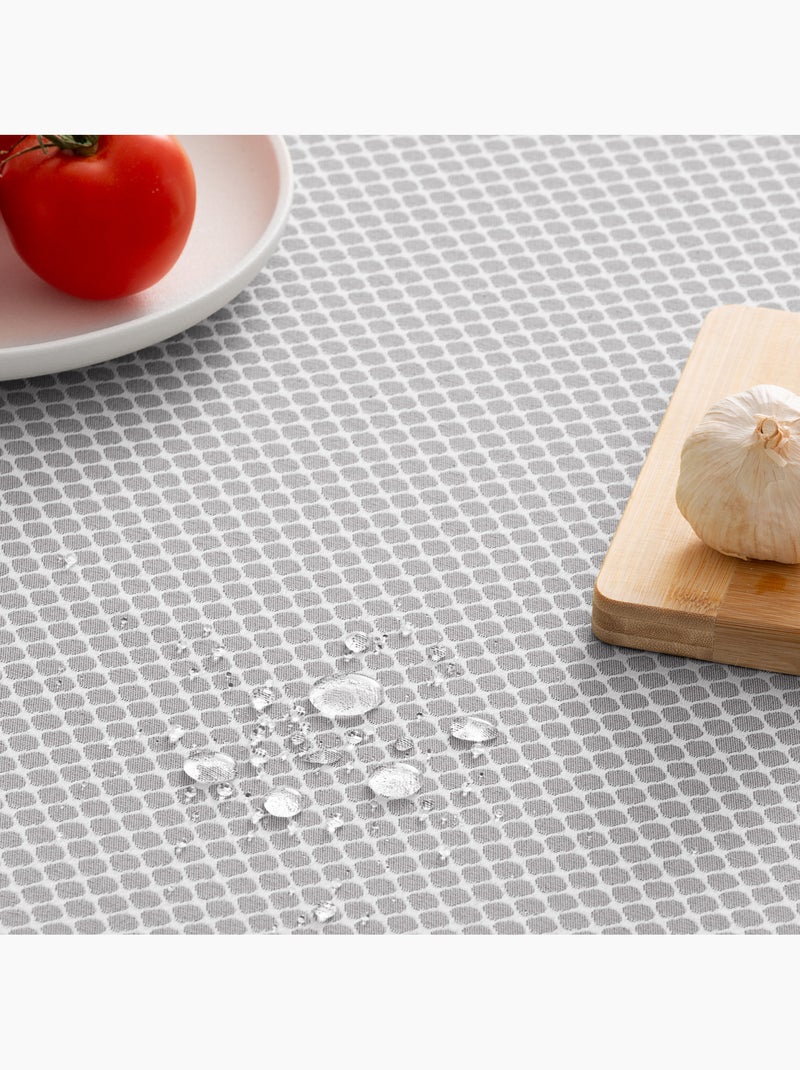 Mantel antimanchas con tejido texturizado, diseño cuadros en rejilla -  Gamusi. Gris claro - Kiabi