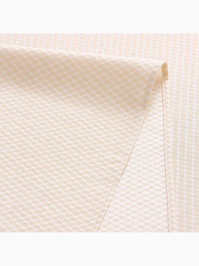 Mantel antimanchas con tejido texturizado, diseño cuadros en rejilla -  Gamusi. Oro - Kiabi