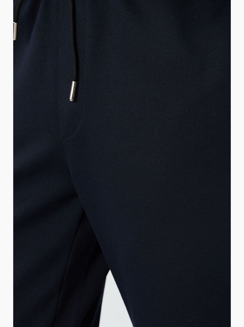Men's pantalones de chándal de forro polar de corte regular tommy Azul laguna - Kiabi