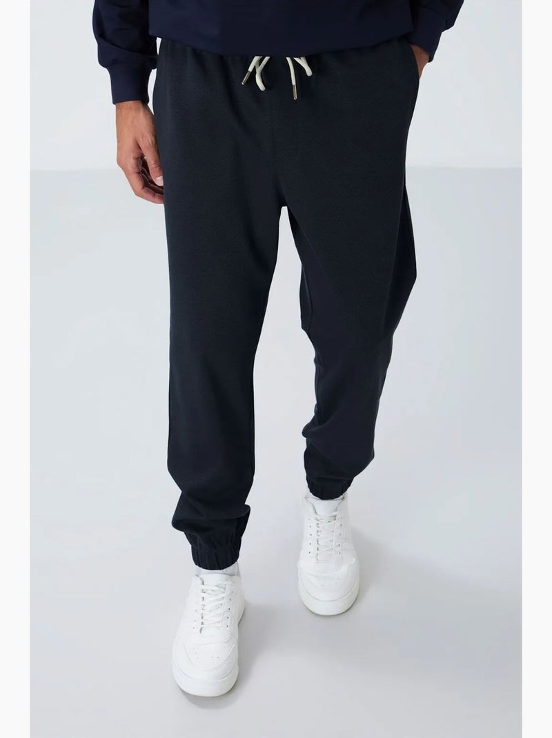 Men's pantalones de chándal de forro polar de corte regular tommy Índigo - Kiabi