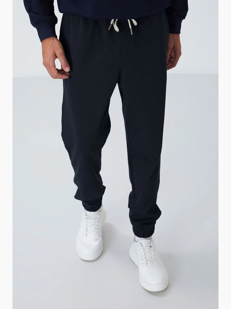 Men's pantalones de chándal de forro polar de corte regular tommy Índigo - Kiabi