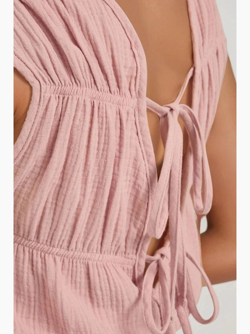 Mono texturizado de pierna corta con cuello redondo hiccup Rosa almendra - Kiabi