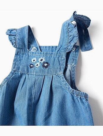 Mono vaquero con flores bordadas