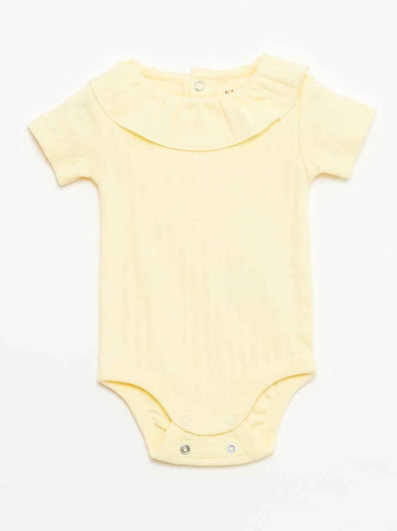 Pack body evolutivo + pijama en punto canalé Amarillo - Kiabi