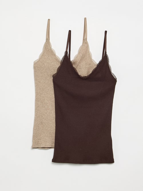 Pack de 2 camisetas de tirantes de canalé con encaje - Kiabi Pack de 2 camisetas de tirantes de canalé con encaje - Kiabi