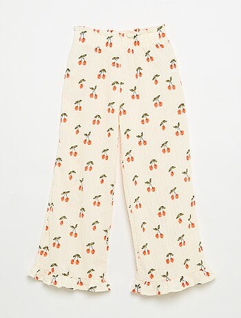 Pantalón ancho con bajo con volantes