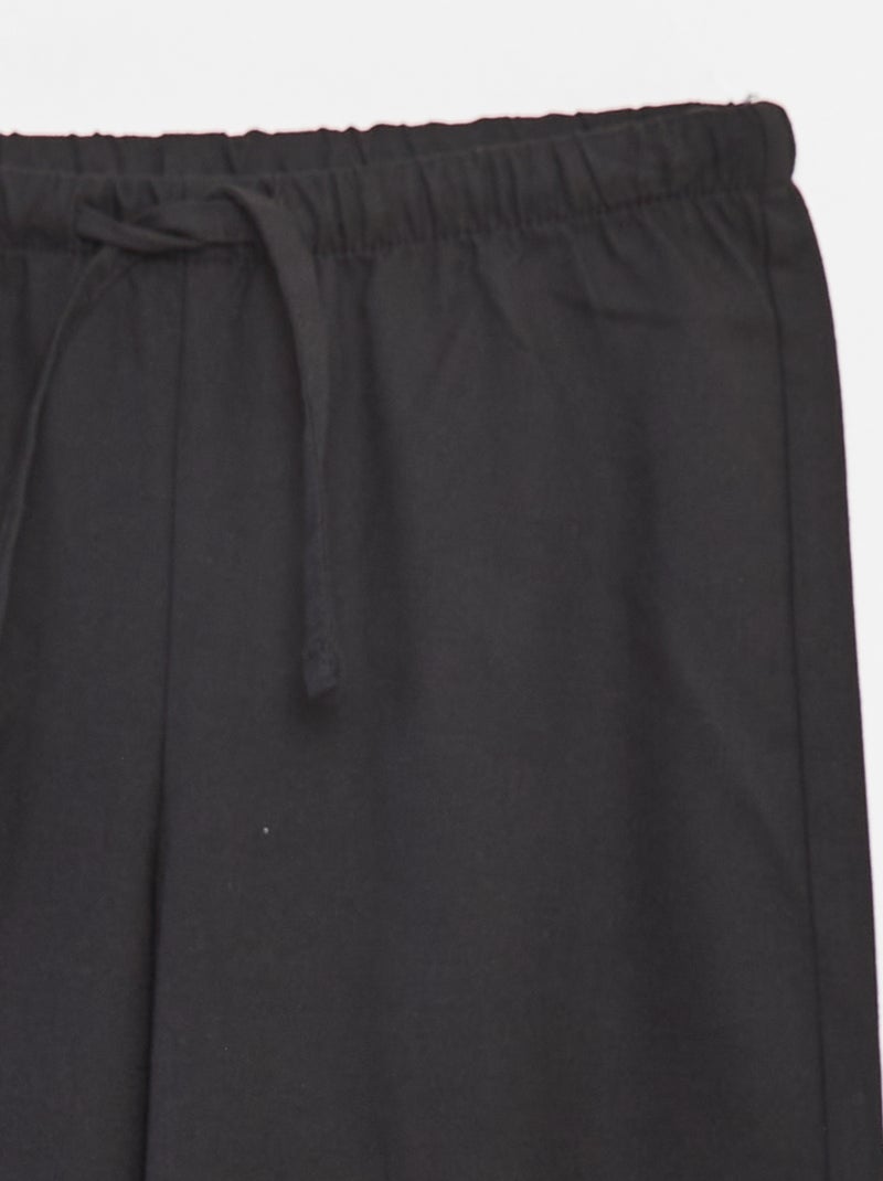 Pantalón ancho con cintura elástica y 2 bolsillos negro - Kiabi