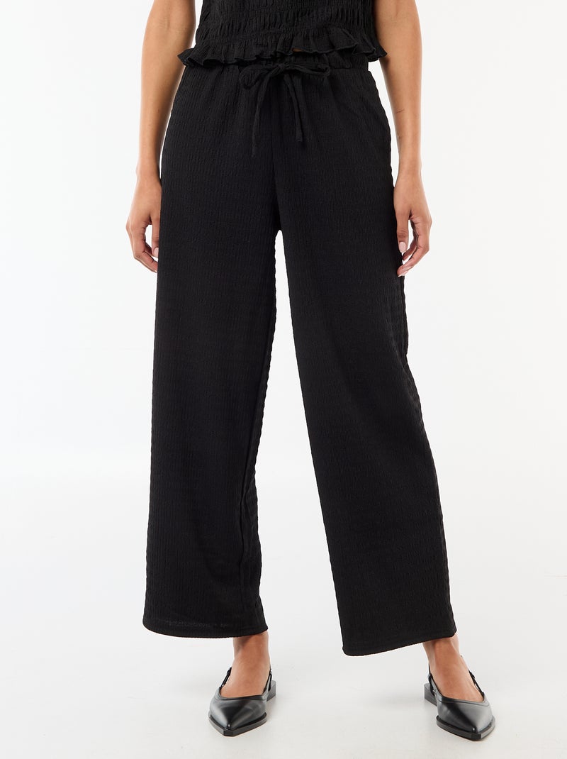 Pantalón ancho de punto smock Negro - Kiabi