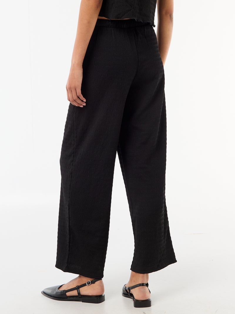 Pantalón ancho de punto smock Negro - Kiabi