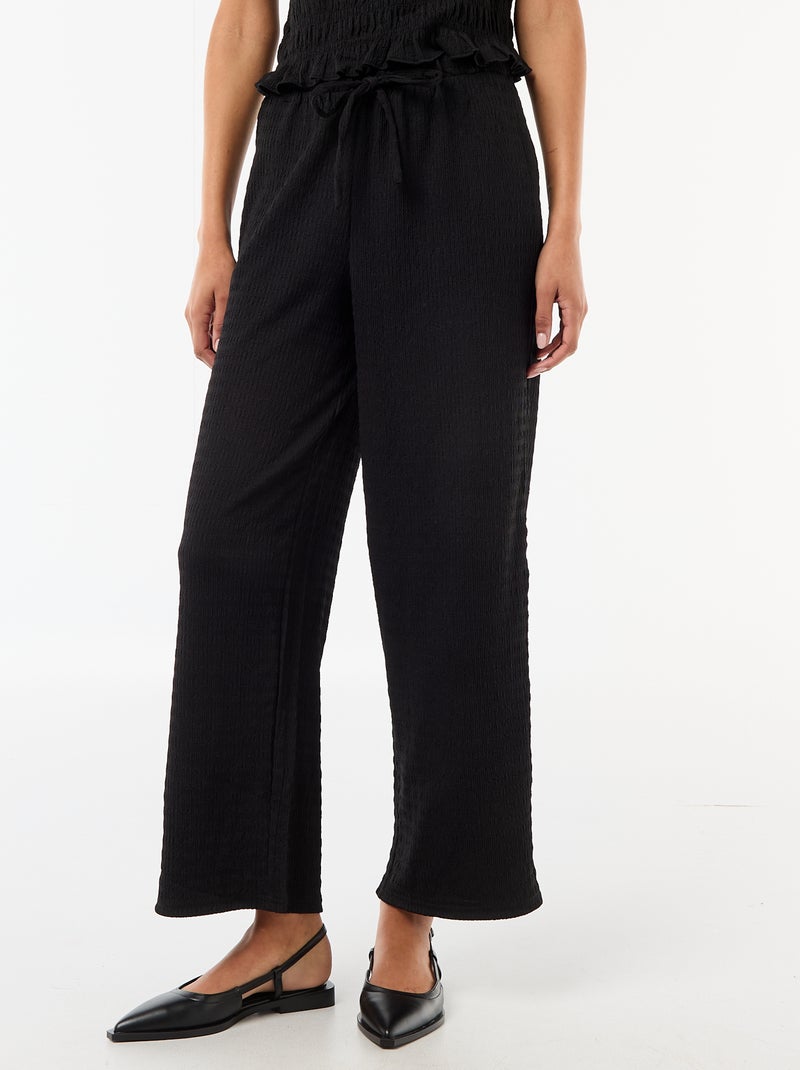 Pantalón ancho de punto smock Negro - Kiabi
