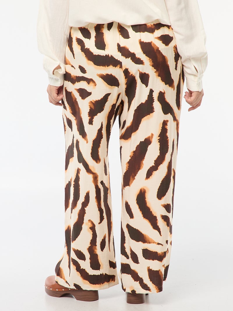 Pantalón ancho vaporoso con motivo all over Beige - Kiabi