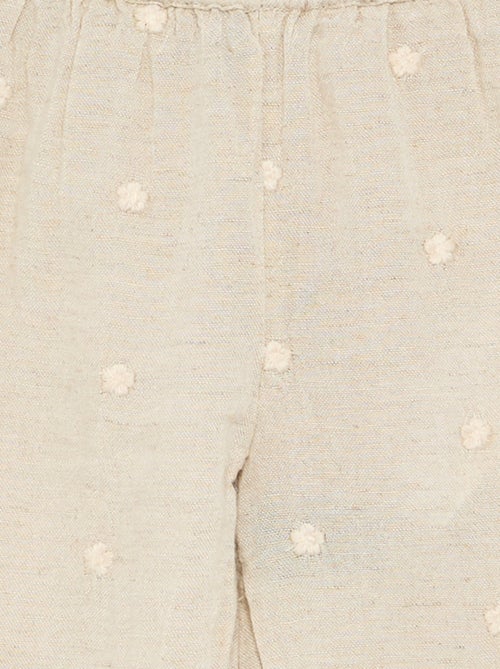 Pantalón con bordados de flores - Kiabi