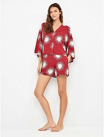 Pantalón corto con estampado de soles
