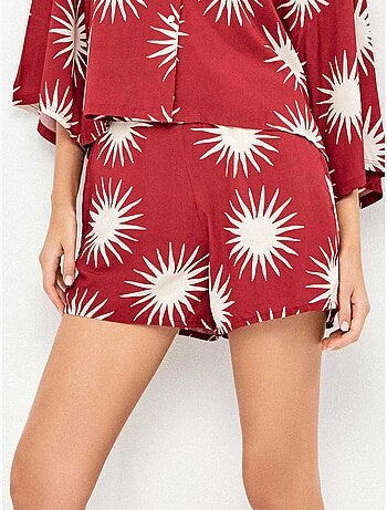 Pantalón corto con estampado de soles
