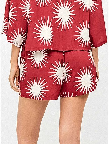 Pantalón corto con estampado de soles