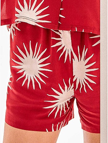 Pantalón corto con estampado de soles