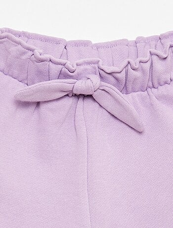 Pantalón corto con volantes y lazo en la cintura