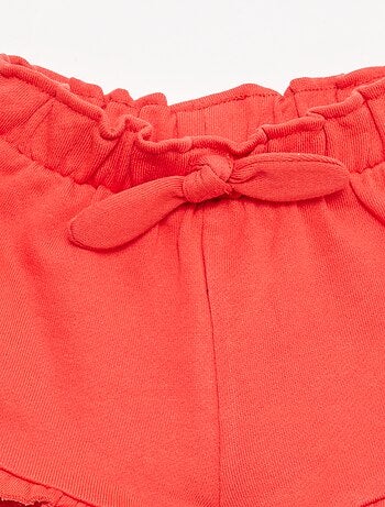 Pantalón corto con volantes y lazo en la cintura