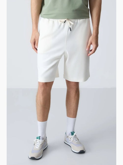 Pantalón corto de felpa para hombre de mezcla de algodón tommy - Kiabi Pantalón corto de felpa para hombre de mezcla de algodón tommy - Kiabi