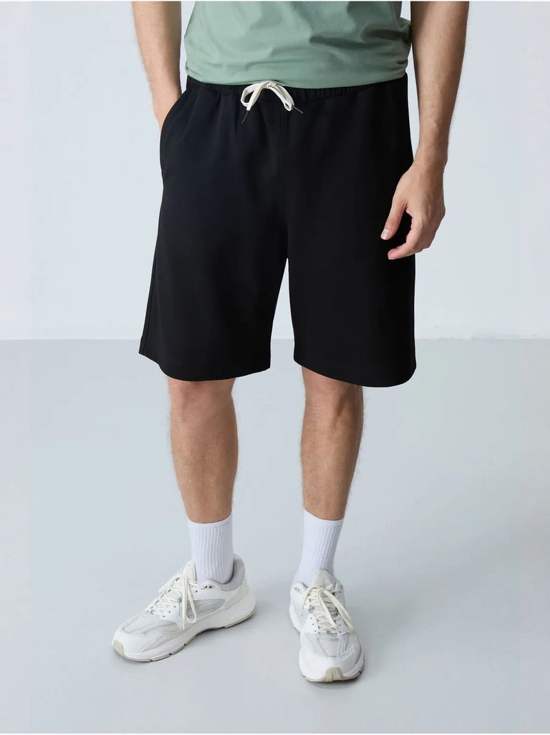 Pantalón corto de felpa para hombre de mezcla de algodón tommy Negro - Kiabi