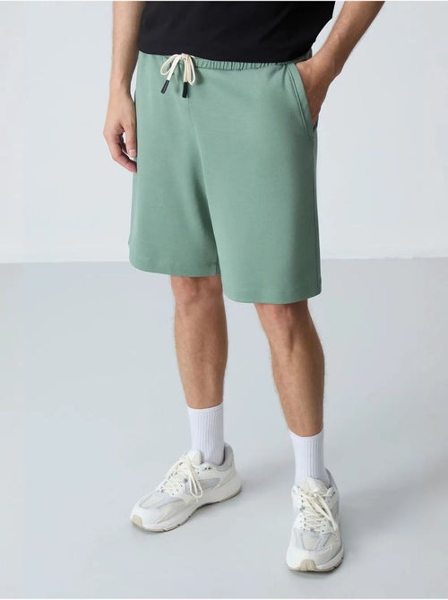 Pantalón corto de felpa para hombre de mezcla de algodón tommy - Kiabi Pantalón corto de felpa para hombre de mezcla de algodón tommy - Kiabi