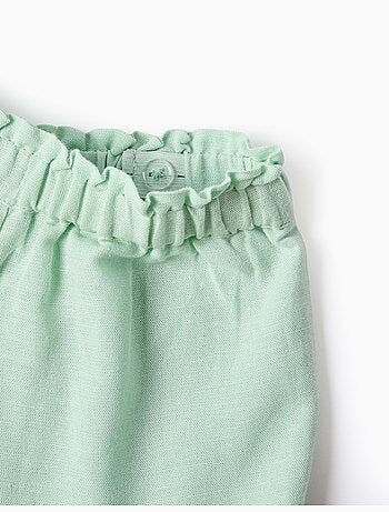 Pantalón corto en algodón y lino con dobladillo con volantes
