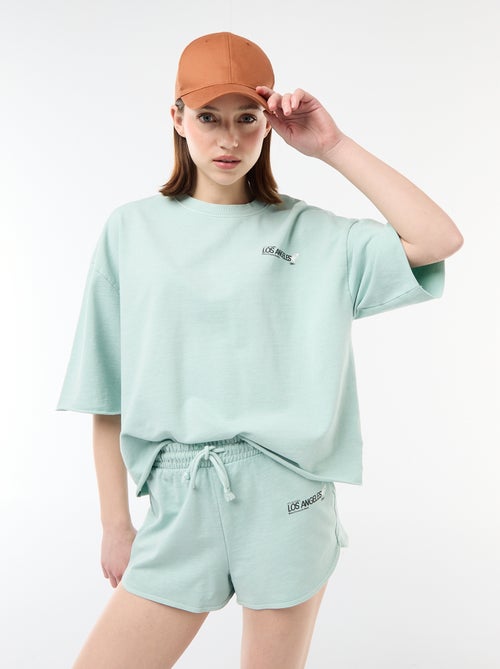 Pantalón corto en felpa con inscripción - Kiabi